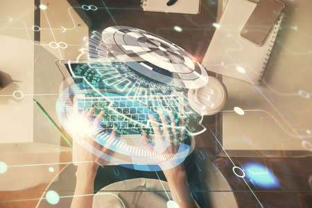 Double exposure of woman hands working on computer and data theme hologram drawing. Top View. Technology concept.の写真素材
