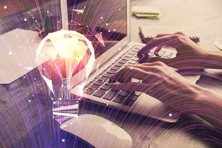 Double exposure of woman hands typing on computer and light bulb drawing. Idea concept.