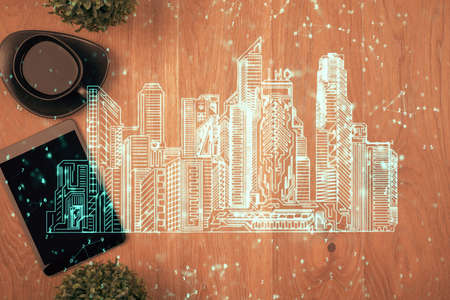 Multi exposure of smart city technology drawing over table with phone. Top view.の写真素材