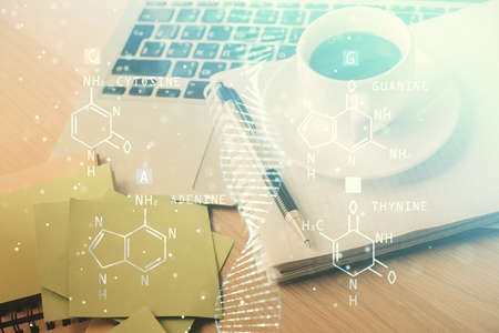 Double exposure of DNA drawing and desktop with coffee and items on table background. Concept of...