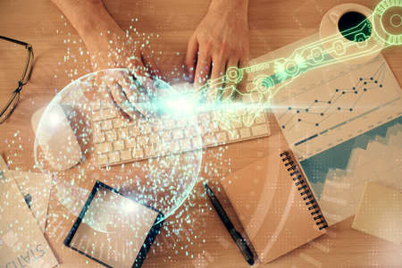 Double exposure of man's hands typing over computer keyboard and data theme hologram drawing. Top...