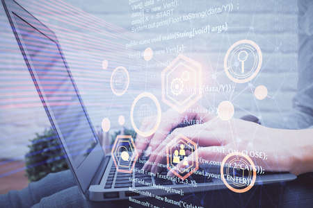 Double exposure of woman hands working on computer and data theme hologram drawing. Tech concept.