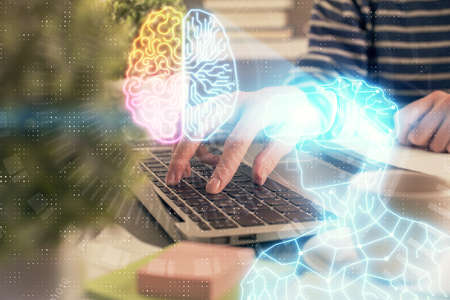 Double exposure of woman hands typing on computer and man in AR glasses drawing. Education concept.の写真素材