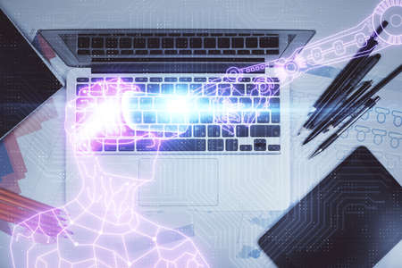 AR hologram drawings over computer on the desktop background. Top view. Multi exposure. Concept of augmented reality.の写真素材