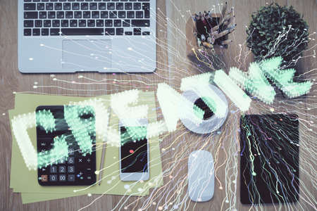 Multi exposure of creative drawing over table with phone. Top view. Concept of startup.