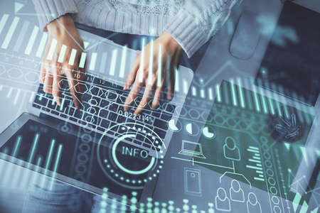 Double exposure of woman hands working on computer and tech theme hologram drawing. Top View....
