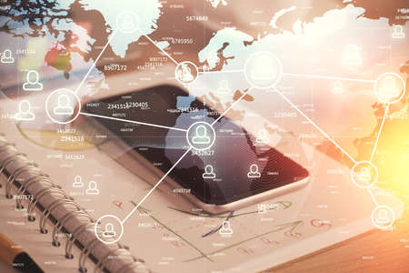 Double exposure of social network theme drawing and cell phone background. Concept of people...