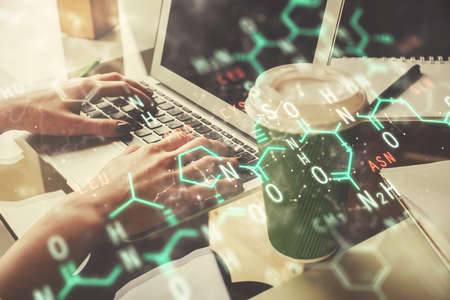 Double exposure of woman hands typing on computer and formula hologram drawing. Education concept.