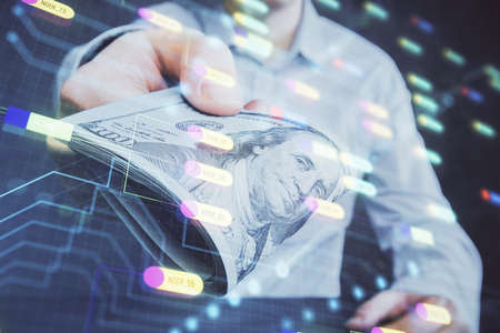 Double exposure of technology drawing hologram and us dollars bills and man hands. Data conceptの写真素材