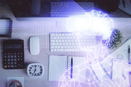 AR hologram drawings over computer on the desktop background. Top view. Multi exposure. Concept of...