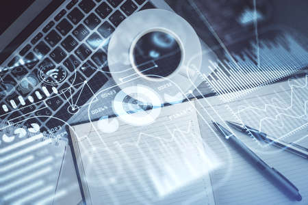 Technology hologram drawing over computer on the desktop background. Top view. Double exposure. Tech concept.の写真素材