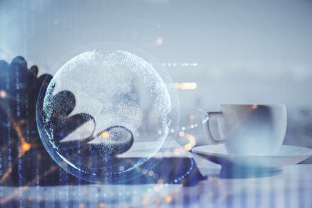 Double exposure of map drawing and desktop with coffee and items on table background. Concept of global data.の写真素材