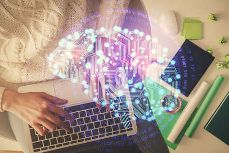 Double exposure of woman working on computer andhuman brain hologram drawing. Top View. Ai concept.