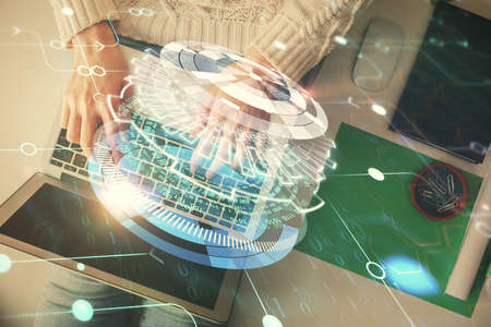 Double exposure of woman hands working on computer and data theme hologram drawing. Top View....