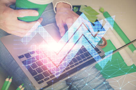 Double exposure of woman hands typing on computer and arrows drawing. Success concept.
