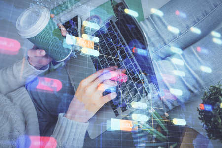 Double exposure of woman hands working on computer and data theme hologram drawing. Tech concept.