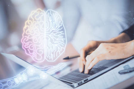 Double exposure of woman hands working on computer and brain hologram drawing. Ai concept.