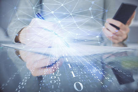 Double exposure of technology sketch hologram and woman holding and using a mobile device.
