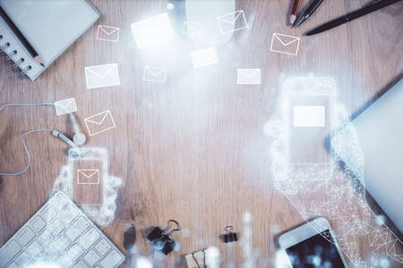 Multi exposure of envelop technology theme drawing over table with phone. Top view. Concept of...