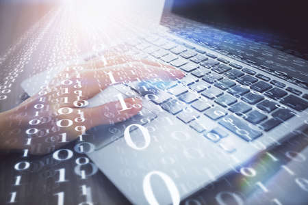 Double exposure of woman hands working on computer and data theme hologram drawing. Tech concept.