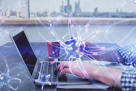 Double exposure of man hands holding a credit card and neuron drawing. Education and E-commerce...