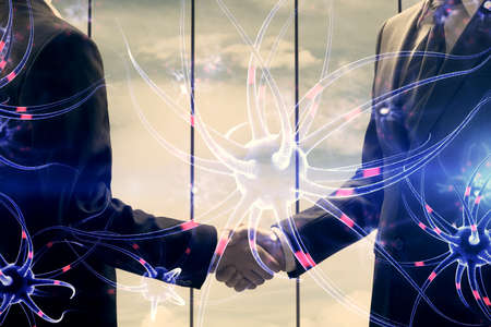 Double exposure of neuron drawings hologram and handshake of two men. Education concept