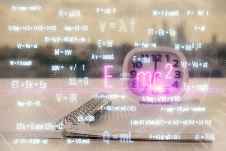 Double exposure of formula drawing and desk with open notebook background. Concept of educationの写真素材