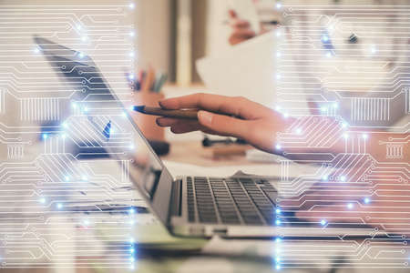 Double exposure of woman hands typing on computer and technology theme drawing. High Tech concept.の写真素材