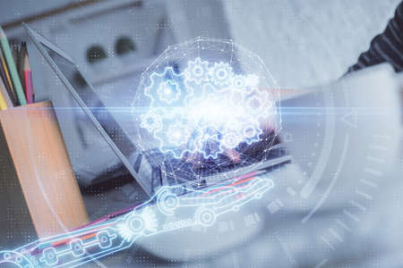 Double exposure of woman hands working on computer and data theme hologram drawing. Tech concept.