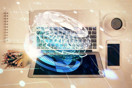 Multi exposure of data theme drawing hologram over topview work desk background with computer....