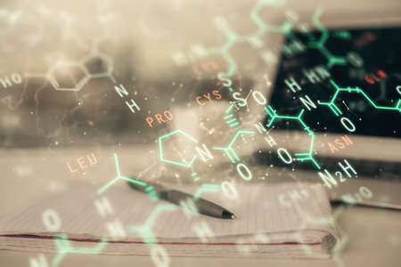 Double exposure of formula drawing and desk with open notebook background. Concept of educationの写真素材
