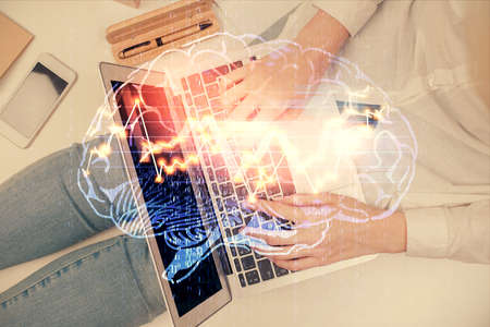 Double exposure of woman working on computer andhuman brain hologram drawing. Top View. Ai concept.