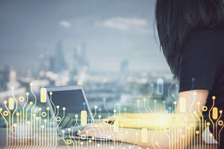 Multi exposure of woman hands working on computer and data theme hologram drawing. Tech concept.
