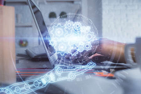 Double exposure of woman hands working on computer and data theme hologram drawing. Tech concept.