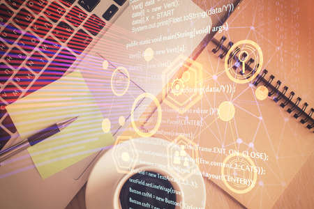 Double exposure of data theme drawing hologram over topview work table background with computer....