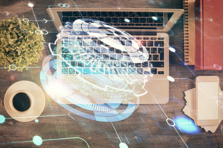 Multi exposure of data theme drawing hologram over topview work desk background with computer. Concept of technology.の写真素材