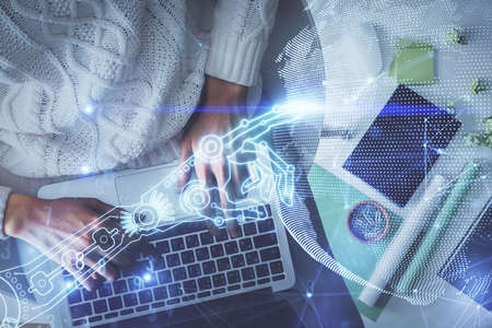 Double exposure of woman hands working on computer and tech theme hologram drawing. Top View....