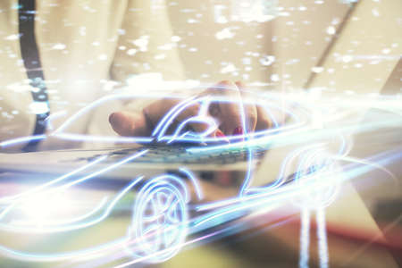 Double exposure of woman hands typing on computer and automobile theme drawing. High Tech concept.の写真素材
