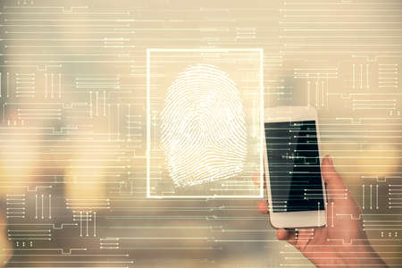 Double exposure of fingerprint hologram and woman holding and using a mobile device. Security...