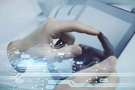 Multi exposure of man's hand holding and using a digital device and data theme drawing. Innovation...