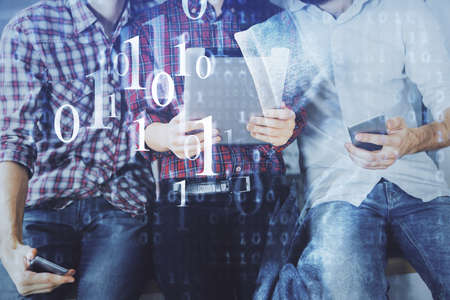Double exposure of data theme hologram drawing and man and woman working together holding and using...