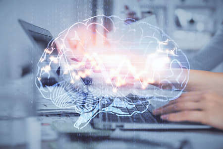 Multi exposure of woman hands working on computer and brain hologram drawing. Ai concept.の写真素材