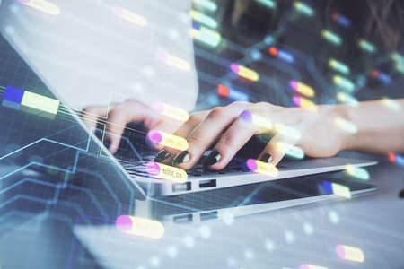 Double exposure of woman hands working on computer and data theme hologram drawing. Tech concept.