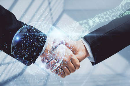 Double exposure of data theme hologram and handshake of two men. Partnership in IT industry concept.