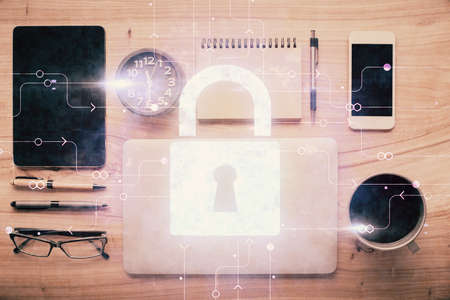 Double exposure of lock drawing over desktop. Top view. Security concept.