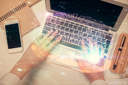 Double exposure of woman hands working on computer and data theme hologram drawing. Top View....