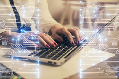 Double exposure of woman hands typing on computer and technology theme drawing. High Tech concept.