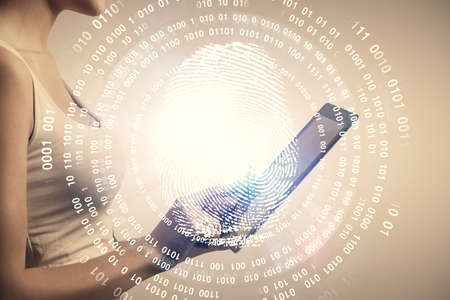 Double exposure of fingerprint hologram and woman holding and using a mobile device. Security concept.の写真素材