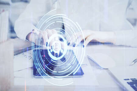 Double exposure of technology sketch hologram and woman holding and using a mobile device. Ai...