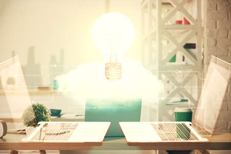 Double exposure of bulb and office interior background. Concept of idea.